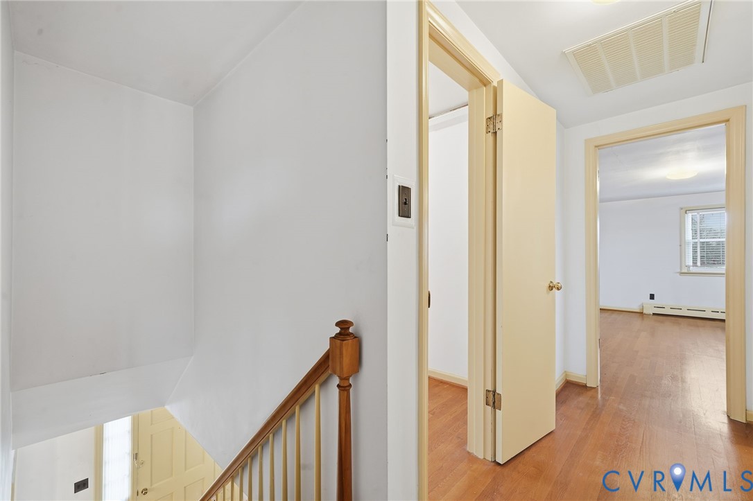 6726 Newtown Road St. Stephens Church, VA 23148 - Photo 36 of 50 a view of a hallway with wooden floor and staircase