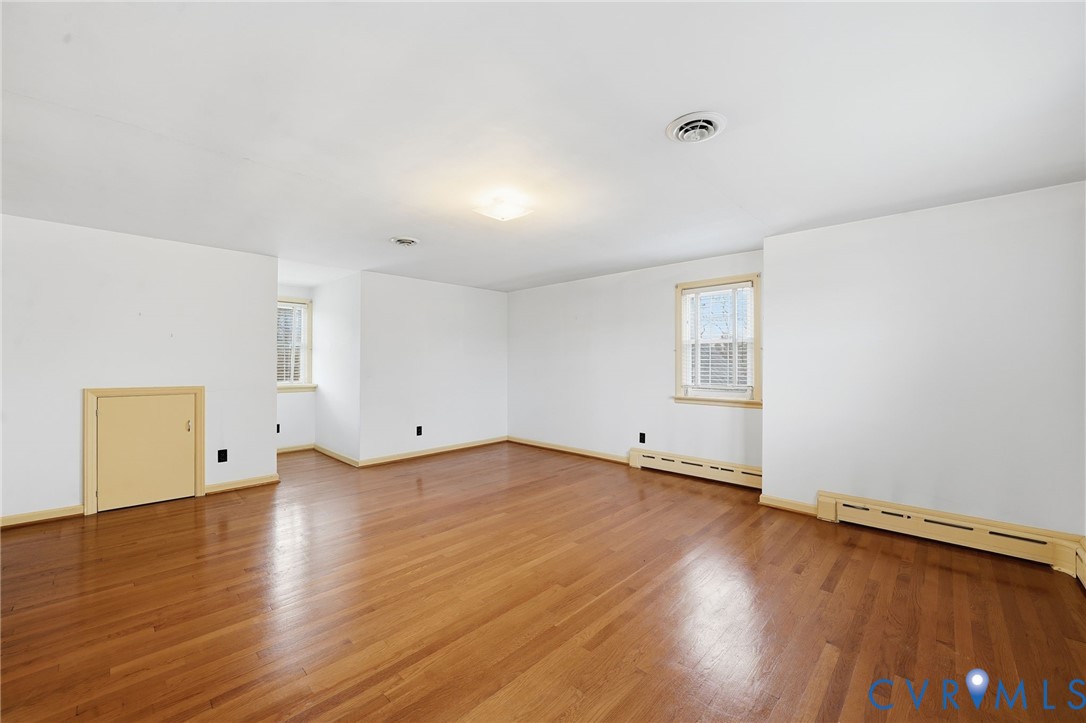 6726 Newtown Road St. Stephens Church, VA 23148 - Photo 37 of 50 an empty room with wooden floor and windows