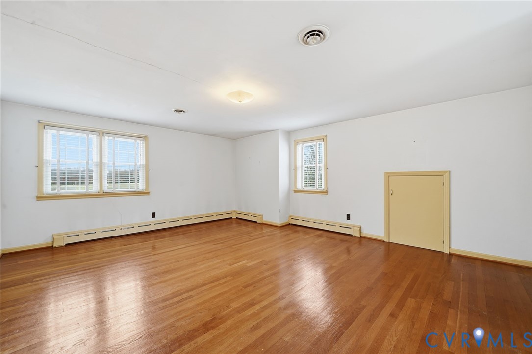 6726 Newtown Road St. Stephens Church, VA 23148 - Photo 40 of 50 a view of an empty room with wooden floor and a window