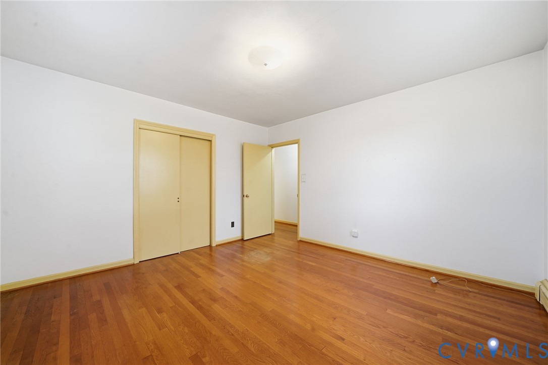 6726 Newtown Road St. Stephens Church, VA 23148 - Photo 43 of 50 an empty room with wooden floor and windows