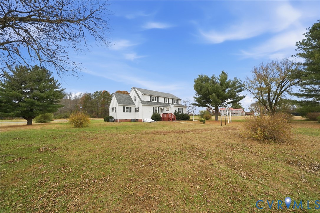 6726 Newtown Road St. Stephens Church, VA 23148 - Photo 5 of 50 a front view of a house with a yard and mountain view