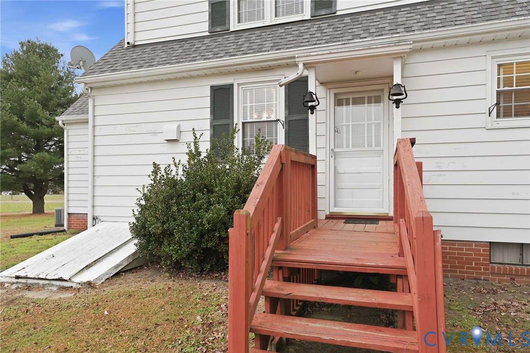 6726 Newtown Road St. Stephens Church, VA 23148 - Photo 10 of 50 a view of a house with a large window and stairs