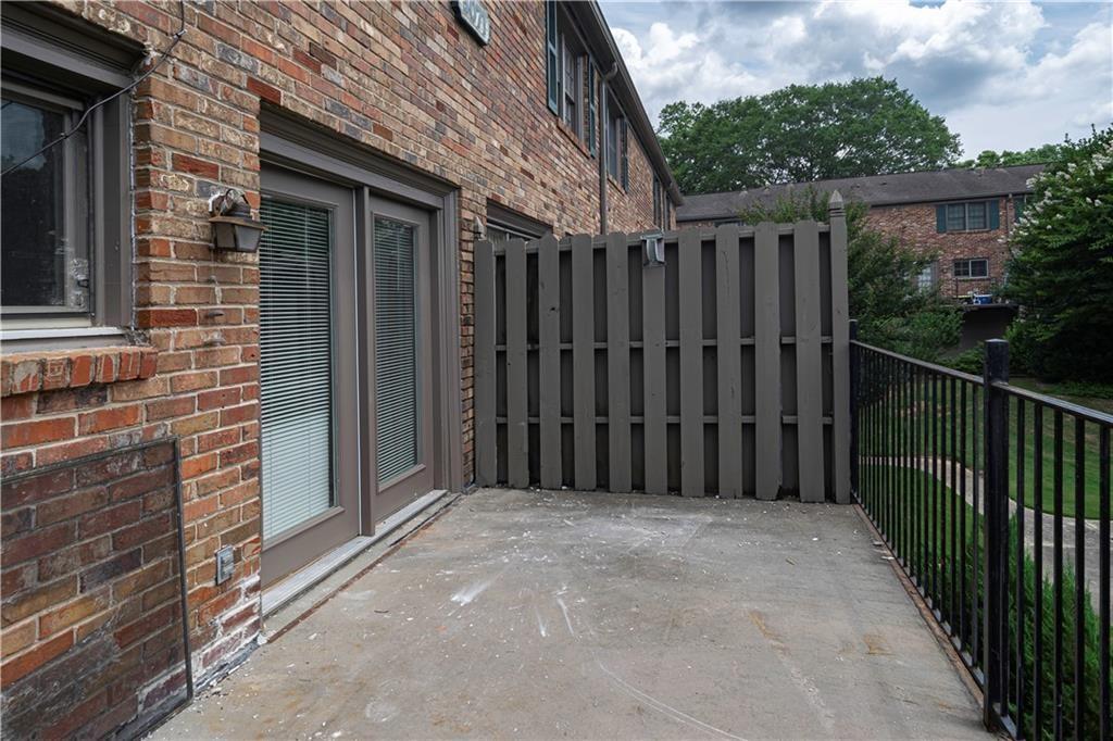 3071 Colonial Way, Unit E Atlanta, GA 30341 - Photo 11 of 16 a view of a wooden door with a wooden fence