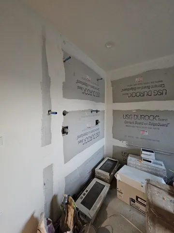 walk in closet with wooden floor