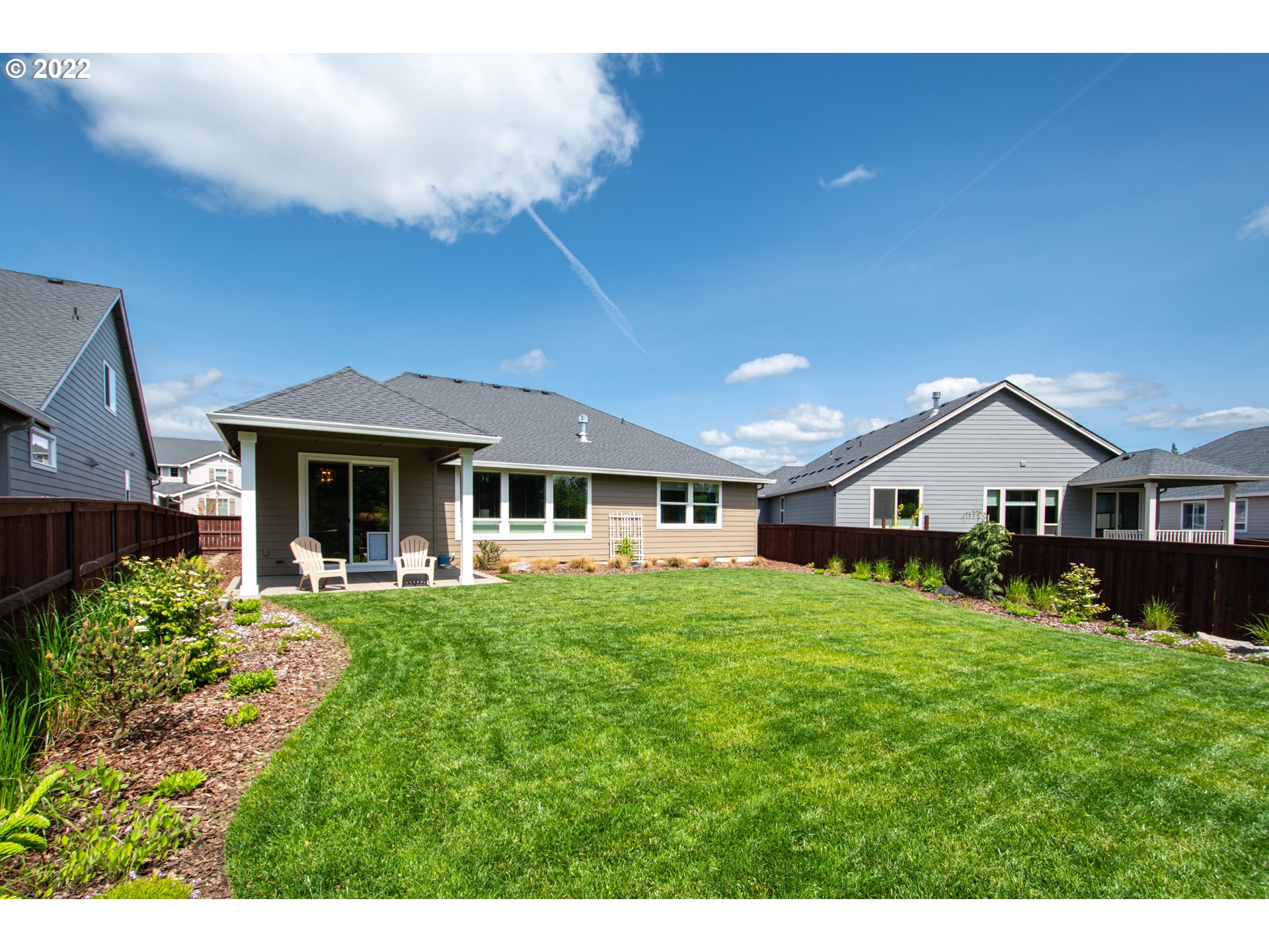 4943 South 19th Street Ridgefield, WA 98642 - Photo 21 of 30 a front view of a house with a garden