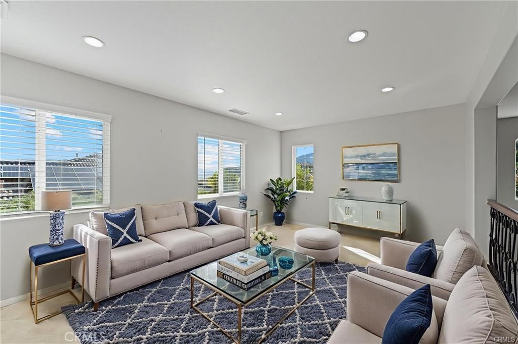 8634 Hunt Canyon Road Corona, CA 92883 - Photo 15 of 31 a living room with furniture a rug and a large window