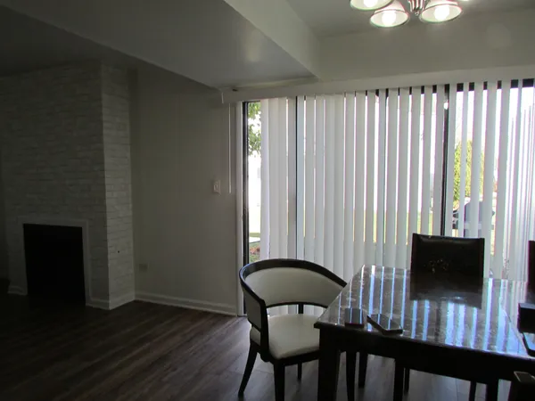 a view of a room with furniture window and wooden floor
