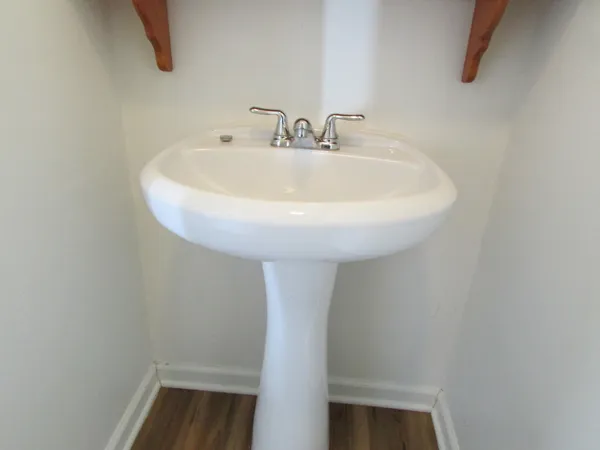 a bathroom with a sink and mirror