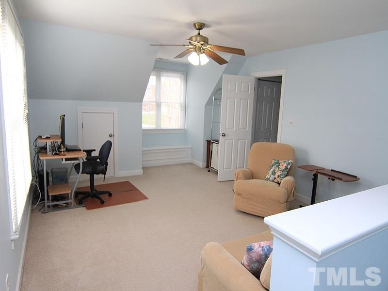 8209 Eden Close Court Raleigh, NC 27613 - Photo 15 of 20 Bonus room has a lot of light, secondary staircase from mudroom and a window seat with storage.