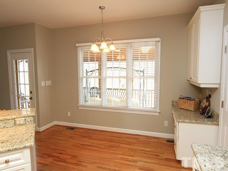 8209 Eden Close Court Raleigh, NC 27613 - Photo 4 of 20 Great view of screened porch and backyard. Has useful built-in desk