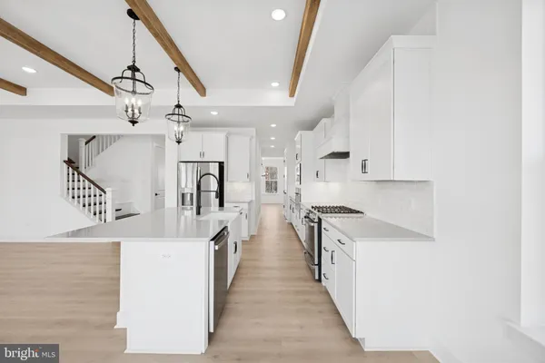 a kitchen with a stove and a refrigerator