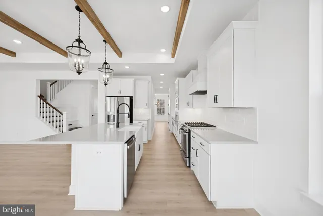 a kitchen with a stove and a refrigerator