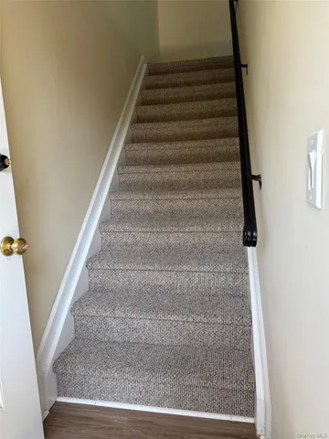 a view of a room window and wooden floor