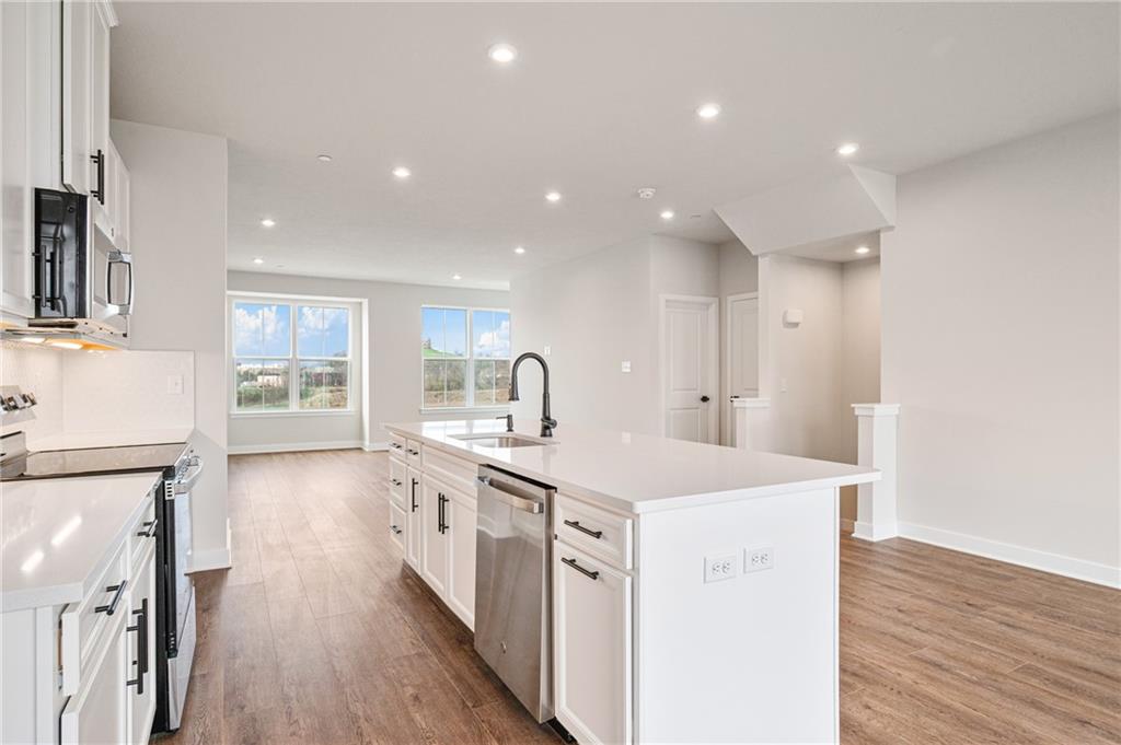 108 Scenic Ridge Drive Venetia, PA 15367 - Photo 21 of 32 a large kitchen with stainless steel appliances a lot of counter space and wooden floor