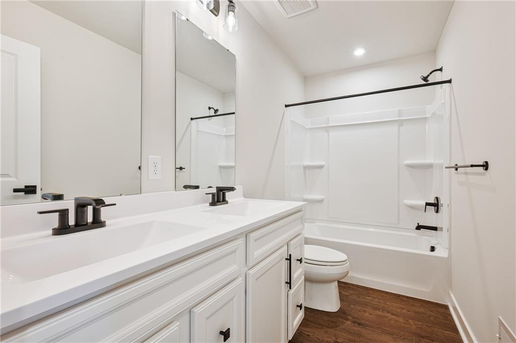 108 Scenic Ridge Drive Venetia, PA 15367 - Photo 24 of 32 a bathroom with a sink a toilet and a large mirror