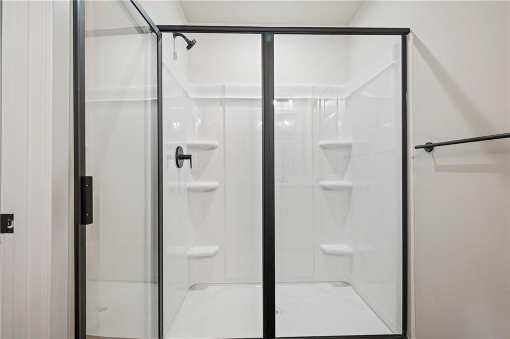 108 Scenic Ridge Drive Venetia, PA 15367 - Photo 30 of 32 a bathroom with a glass shower door