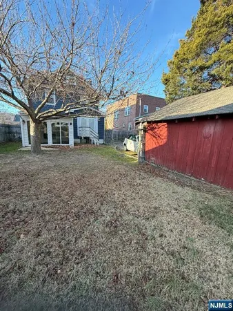 a view of a yard with a house