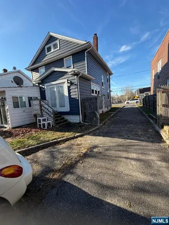 a view of a room with wooden floor and staircase