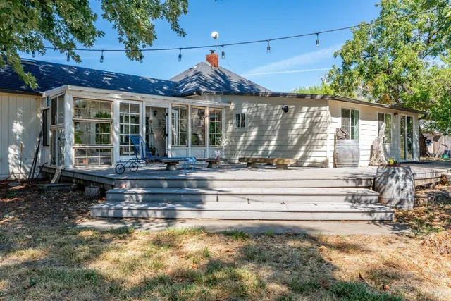 a front view of a house with a swimming pool