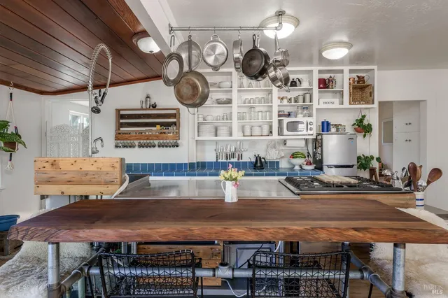a kitchen with a table and chairs in it