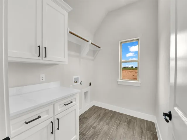 a view of a storage and utility room with closet