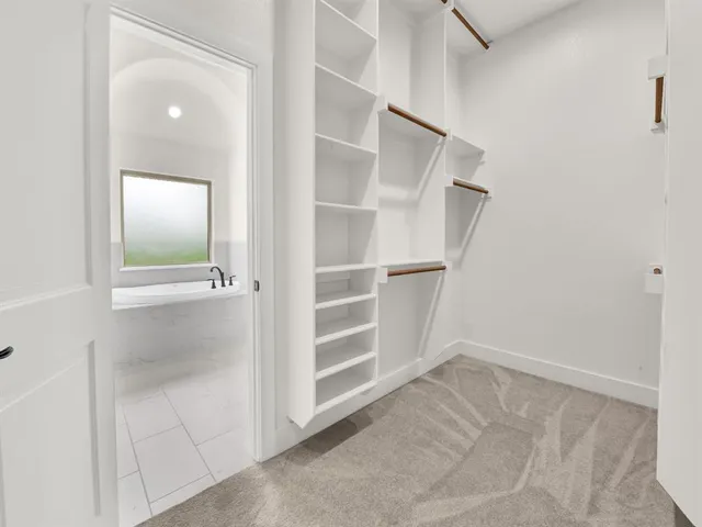 a view of an empty walk in closet