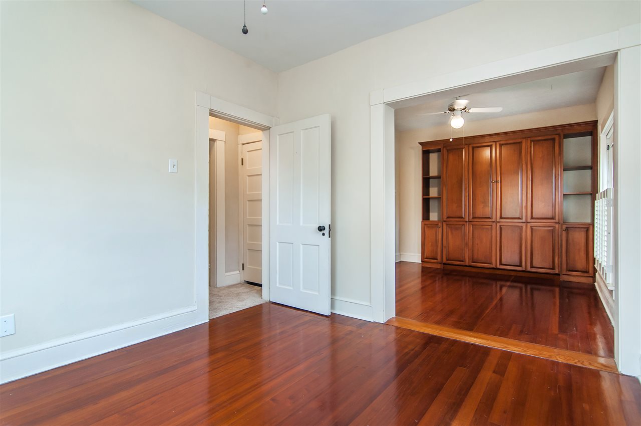 39 Valencia Street St. Augustine, FL 32084 - Photo 27 of 50 wooden floor in an empty room with a window