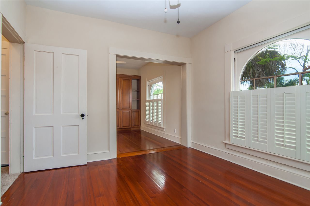 39 Valencia Street St. Augustine, FL 32084 - Photo 29 of 50 wooden floor in an empty room with a window