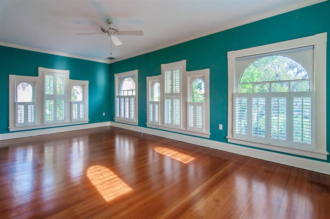 39 Valencia Street St. Augustine, FL 32084 - Photo 40 of 50 a view of an empty room with wooden floor and a window