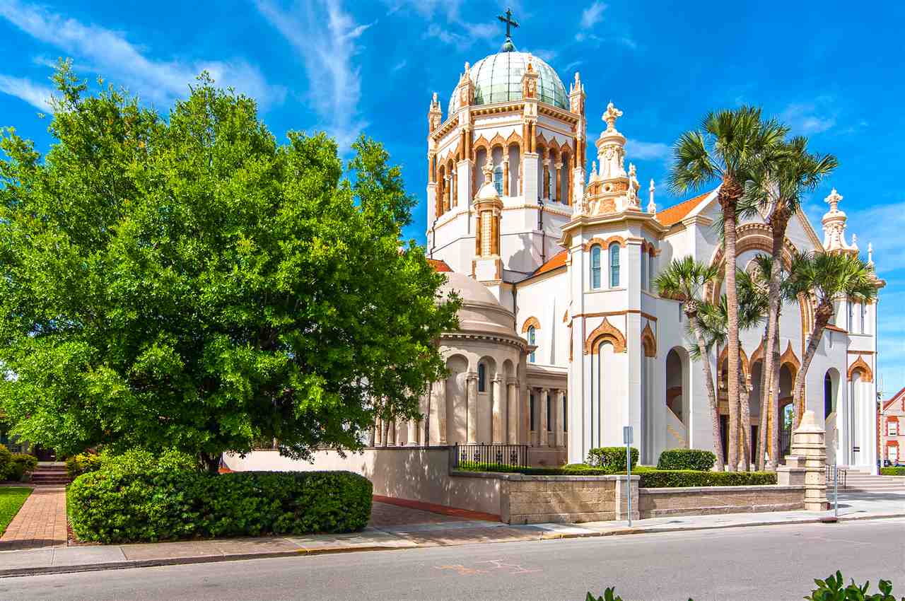 39 Valencia Street St. Augustine, FL 32084 - Photo 50 of 50 a view of a multi story residential apartment building with a yard and potted plants
