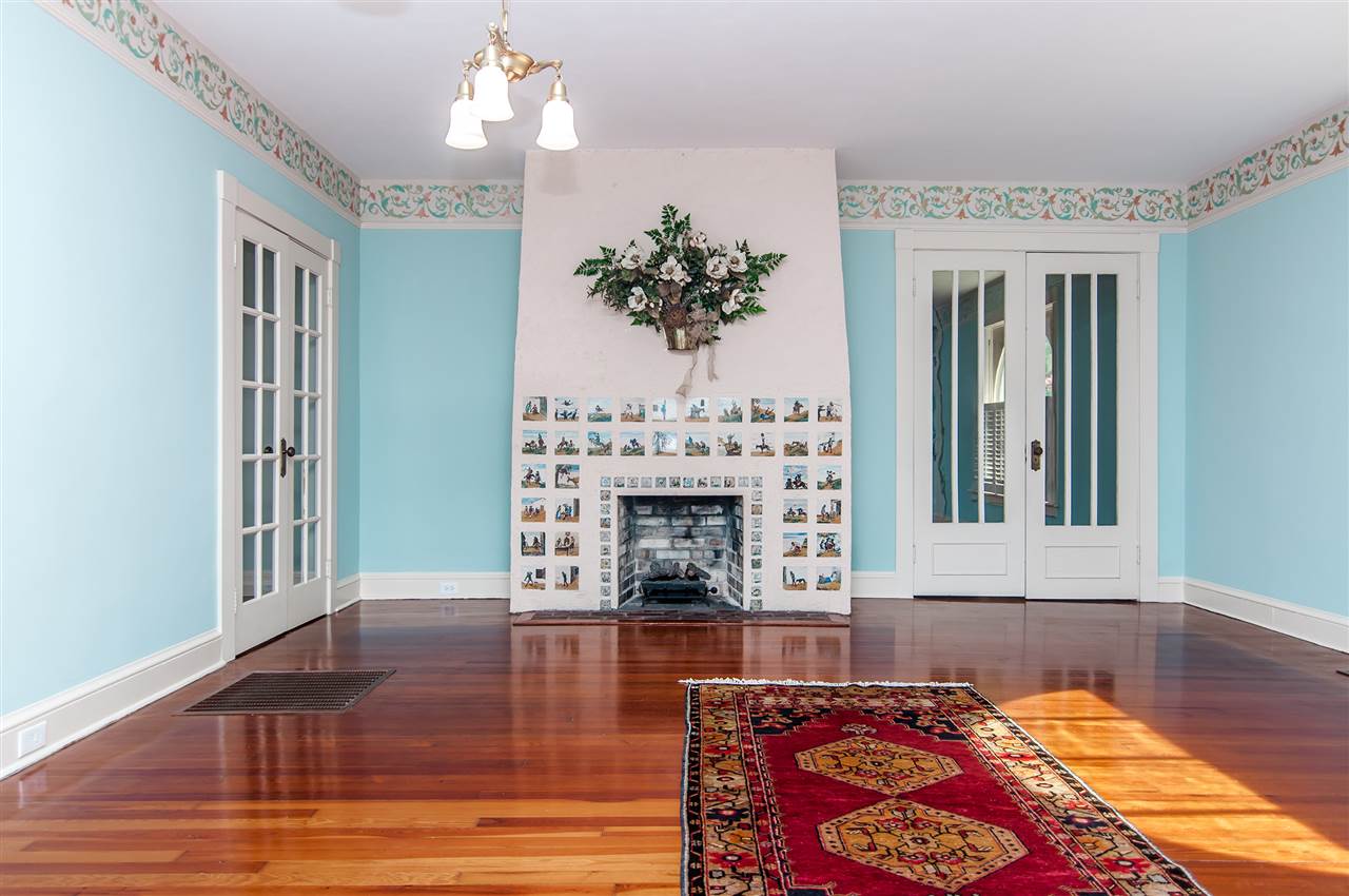 39 Valencia Street St. Augustine, FL 32084 - Photo 6 of 50 a living room with furniture fireplace and window