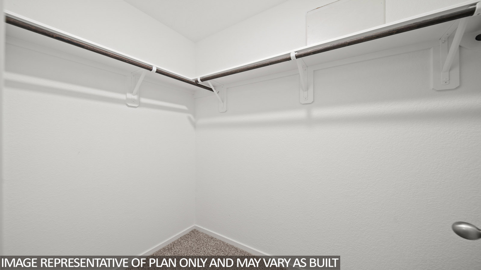 228 Flying Tigers Trail Jarrell, TX 76537 - Photo 12 of 17 Walk-in closet with textured white walls, a corner configuration, and wall-mounted metal hanging rods