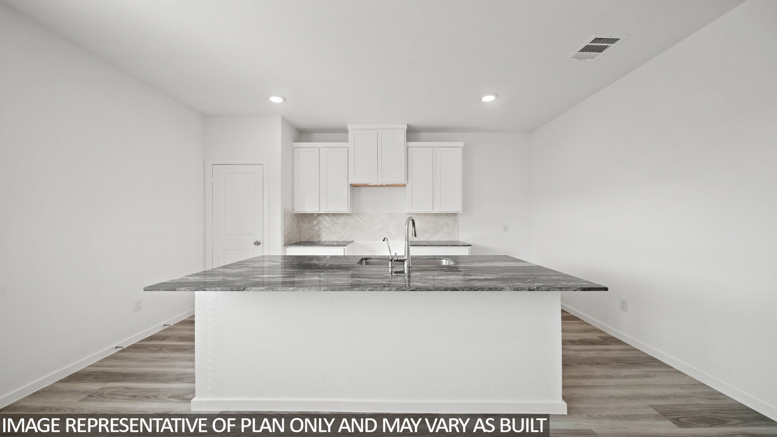 228 Flying Tigers Trail Jarrell, TX 76537 - Photo 5 of 17 Kitchen featuring an expansive island with a stone countertop and integrated sink, white shaker-style cabinetry, stainless steel faucet, and recessed lighting