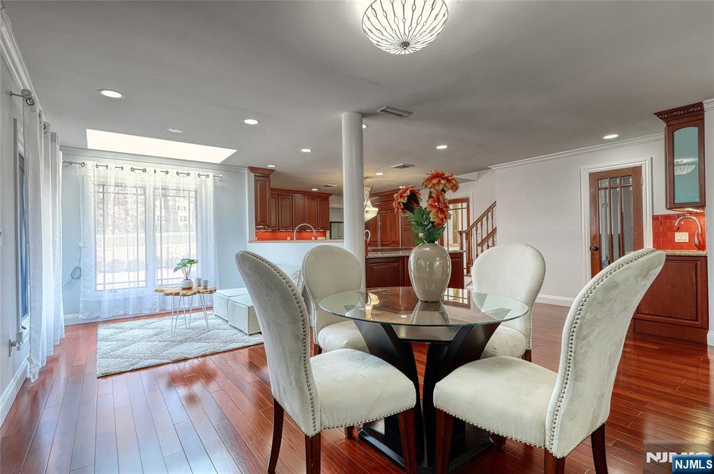 91 Chestnut Ridge Road Saddle River, NJ 07458 - Photo 15 of 41 a view of a dining room with furniture window and wooden floor