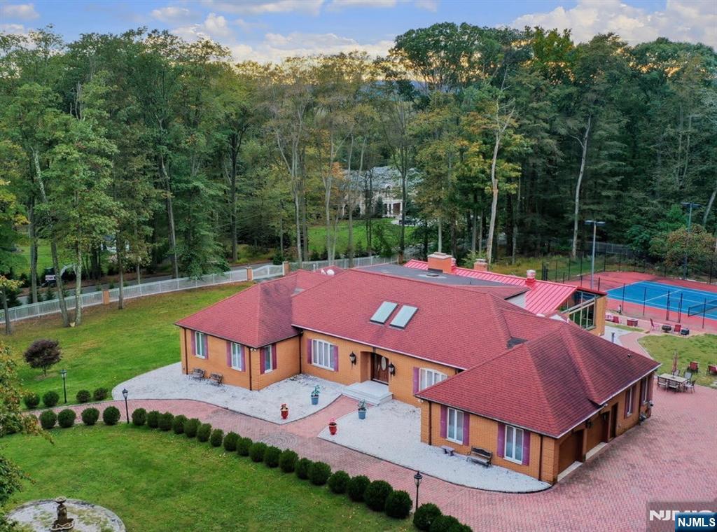 91 Chestnut Ridge Road Saddle River, NJ 07458 - Photo 2 of 41 a view of front of house with a yard