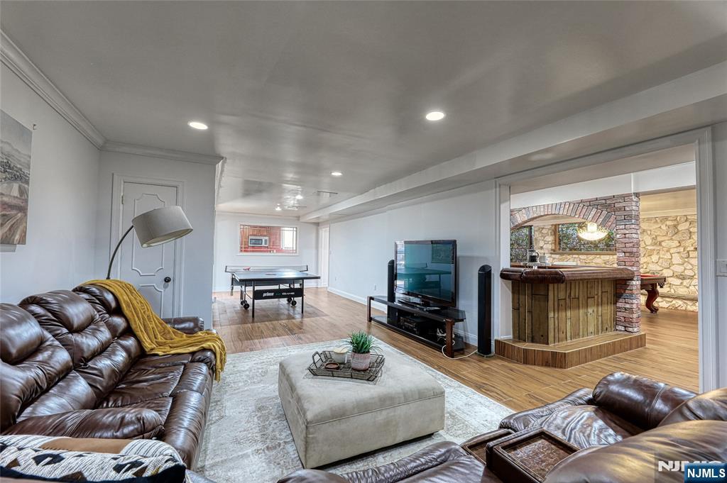 91 Chestnut Ridge Road Saddle River, NJ 07458 - Photo 33 of 41 a living room with furniture and a fireplace