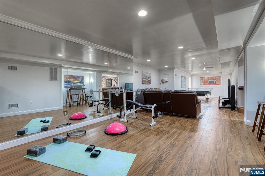 91 Chestnut Ridge Road Saddle River, NJ 07458 - Photo 36 of 41 a room with furniture and a wooden floor