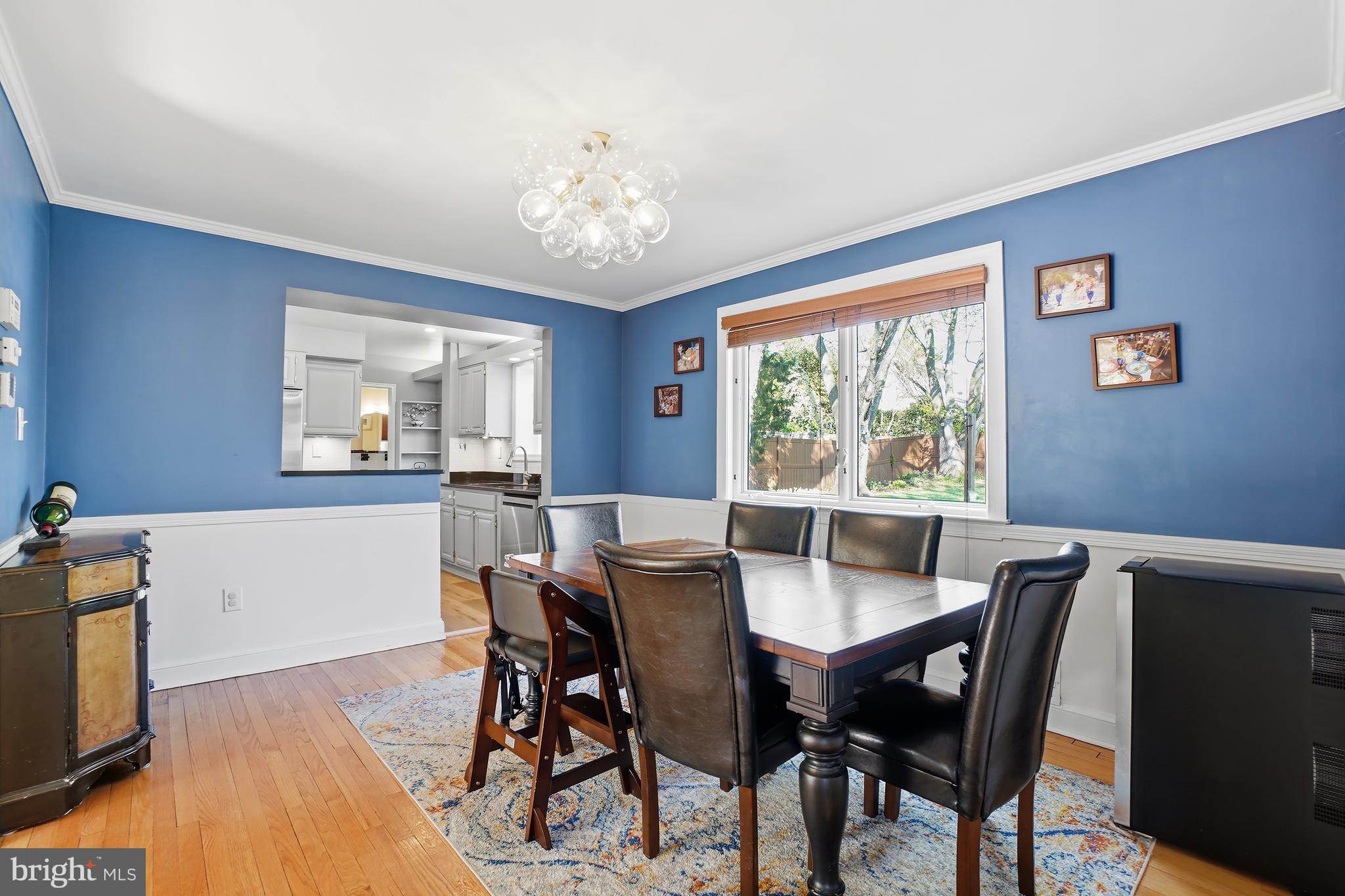 1303 Ballard Street Silver Spring, MD 20910 - Photo 14 of 53 a view of a dining room with furniture window and wooden floor