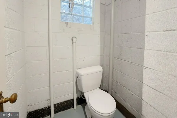 a outdoor space with patio couches and a fireplace