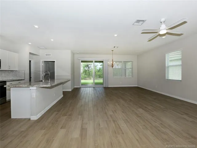 a view of a back yard from a room