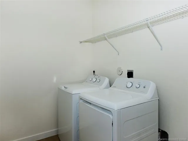 a view of two chairs in the balcony