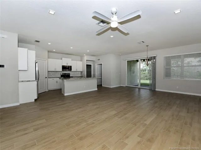 a bathroom with a double vanity sink and mirror