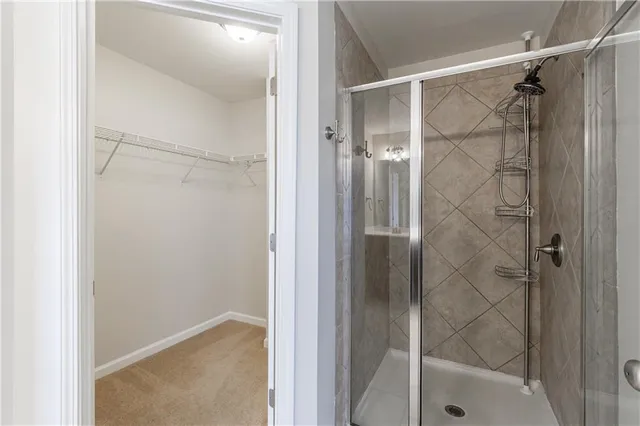 a bathroom with a glass shower door
