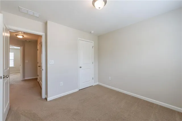 an empty room with a bathroom