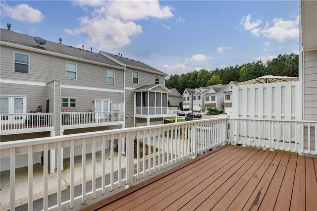 a view of a house with wooden deck