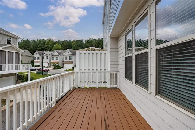 a view of balcony with wooden floor