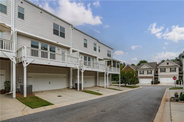 a view of a swimming pool and lounge chairs