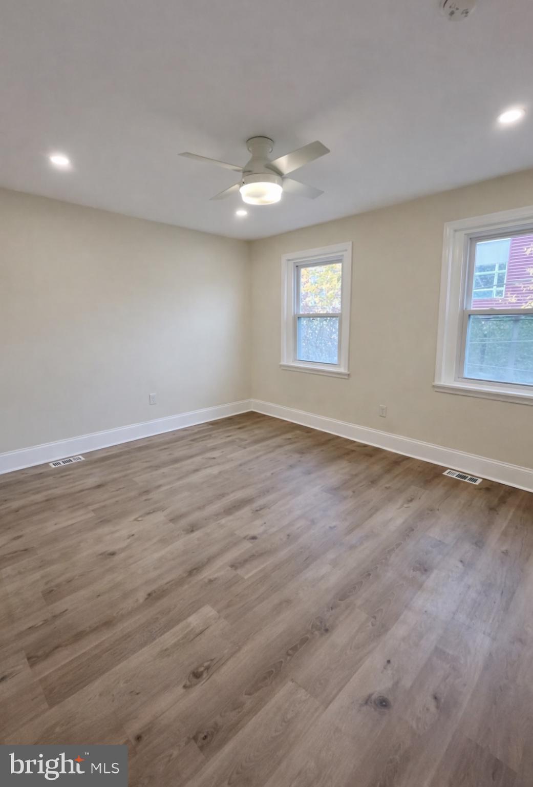 22 Maple Street Conshohocken, PA 19428 - Photo 11 of 22 an empty room with wooden floor and windows