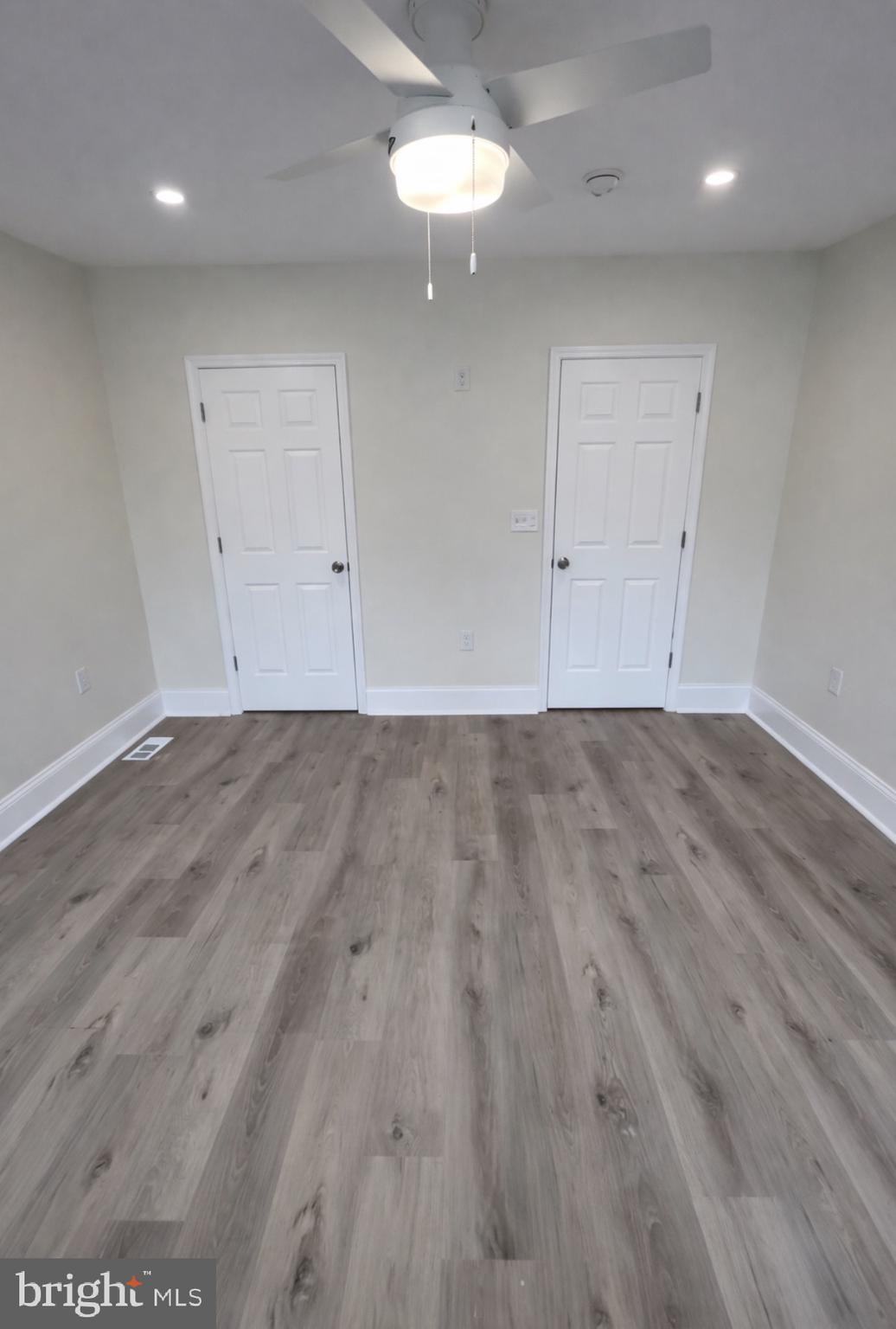 22 Maple Street Conshohocken, PA 19428 - Photo 12 of 22 an empty room with wooden floor cabinet and windows