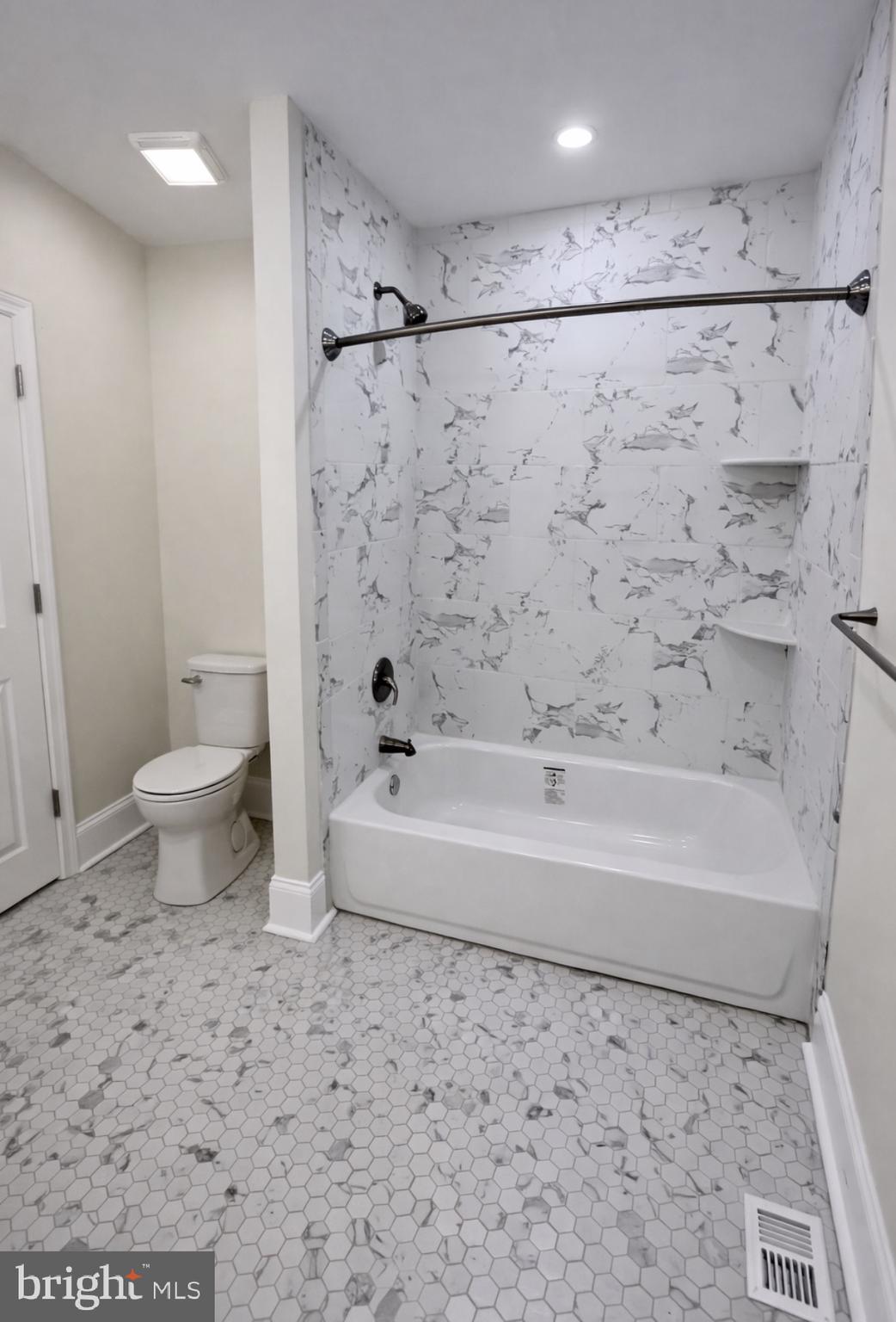 22 Maple Street Conshohocken, PA 19428 - Photo 15 of 22 a bathroom with a bathtub toilet and a shower